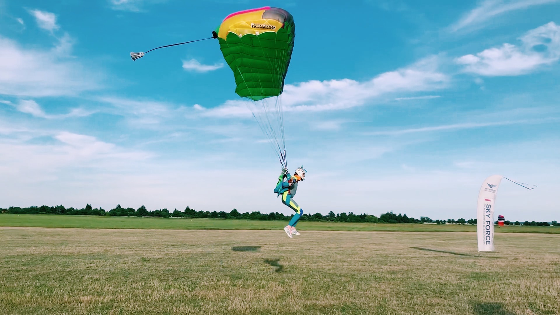 Person in parachute landing